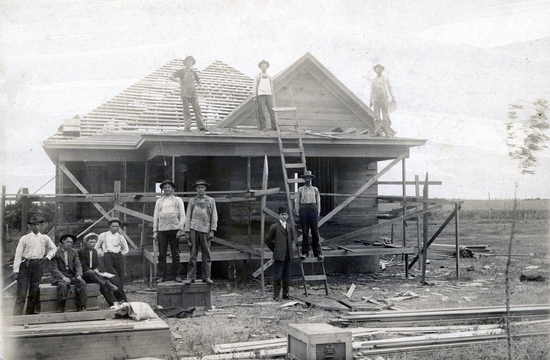 Frank Korn, center, with builders in front of his family’s unfinished home in El Reno. 1908. Courtesy Oklahoma Hall of Fame Archives.